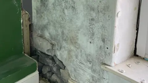 Becs Wadley Black mould in one of the Wadley's bedrooms earlier in 2025