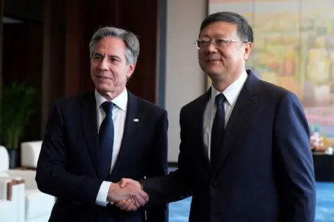 EPA S Secretary of State Antony Blinken (L) shakes hands with Shanghai Party Secretary Chen Jining during a meeting at the Grand Halls in Shanghai on April 25, 2024.