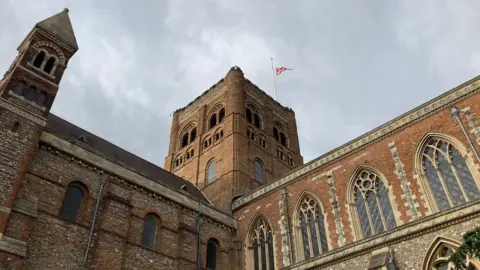 Katy Lewis/BBC Flag at half-mast on St Albans Cathedral
