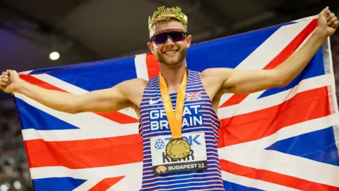 Josh Kerr celebrates winning world 1500m gold