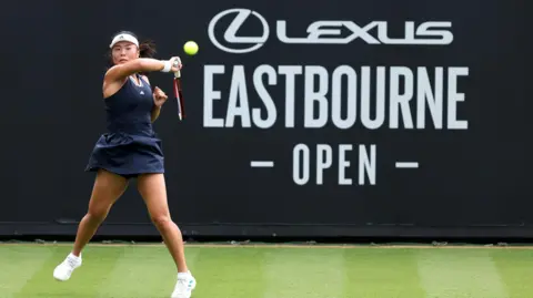 Getty Images Mimi Xu of Great Britain plays a forehand against Elsa Jacquemot of France during the Women's Singles Qualifying match on Day One of the Lexus Eastbourne Open at Devonshire Park on June 20, 2026 in Eastbourne, England.