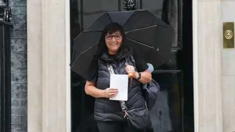 Figen Murray, mother of Manchester Arena bombing victim Martyn Hett, arriving in Downing Street, London.
