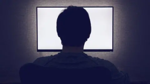 Getty Images Silhoutte of computer user