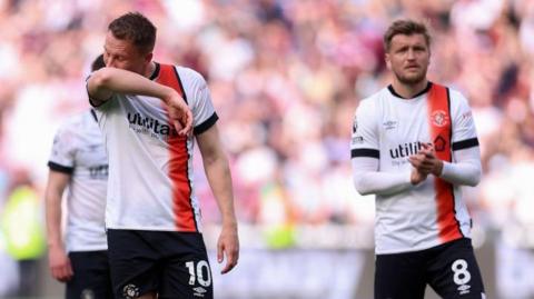 Luton players look dejected after losing at West Ham
