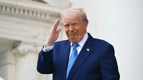 US President Donald Trump arrives to deliver remarks at the National Memorial Day Observance at the Memorial Amphitheatre in Arlington National Cemetery in Arlington, Virginia, on May 26, 2025.