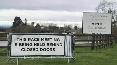 Sign denoting that the Cheltenham Festival is being held behind closed doors