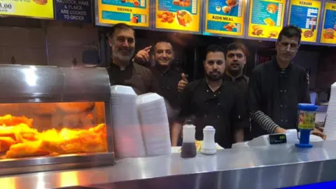 Victoria Fish Bar Staff behind the counter at Victoria Fish Bar