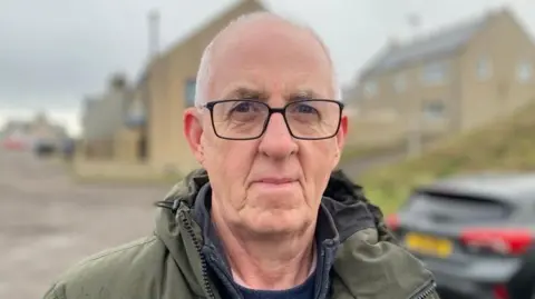 Iain Gale is standing outside in Burghead.
