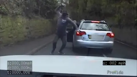 North Wales Police Offender throws a stone at a police officer's car