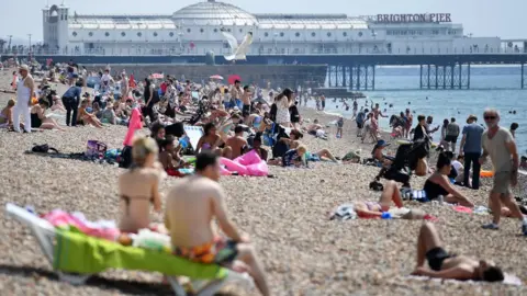 EPA People on beach in Brighton