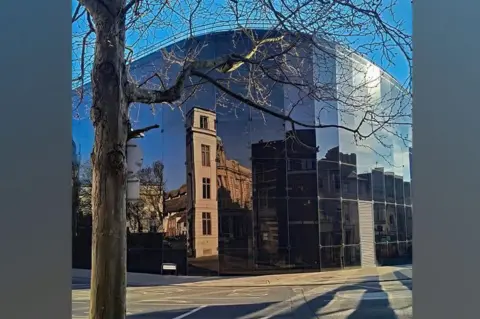 Jim Osley/Geograph Nearby structures reflected at dusk on the dark glass of the Willis building
