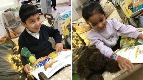Victoria Park Academy Yahya (left) and Aria (right) are seen in two photographs, both of them sitting in the rocking chair in a reading area at Victoria Park Academy. The chair has fairy lights behind it and they children both have cuddly toys and are looking happy.