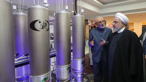 EPA File photo showing Iranian President Hassan Rouhani (R) inspecting nuclear technology in Tehran (9 April 2019)