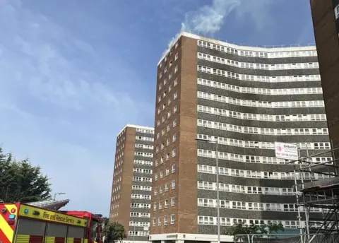 Essex Fire Service Smoke coming out from a Chadwell St Mary flat, in Essex