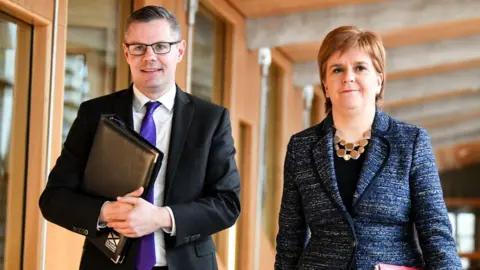 Getty Images Derek Mackay and Nicola Sturgeon