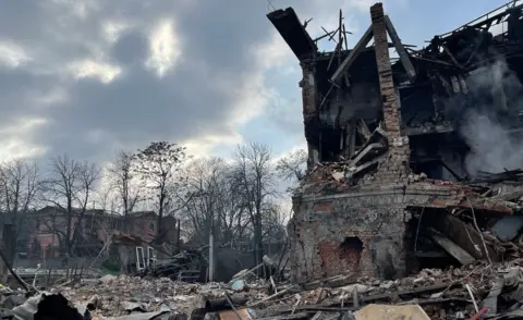 BBC The remains of a women's shoe factory after it came under Russian bombardment