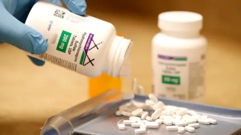 Getty Images Hydroxychloroquine tablets are measured at a pharmaceutical facility , Utah, 20 May 2020