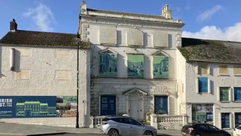 BBC Donwpatrick's former police Station on Irish Street