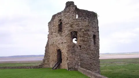 Immanuel Giel A tower section of Flint Castle overlooking the Dee estuary