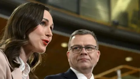 Finnish Prime Minister Sanna Marin (left) and conservative Petteri Orpo (right) at an official election event on 2 April in Helsinki