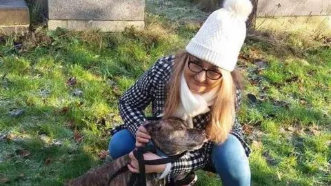 Supplied Izabela Chalastra pictured with a dog