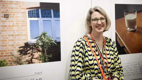 Northampton College Gemma Briggs stands next to her work.