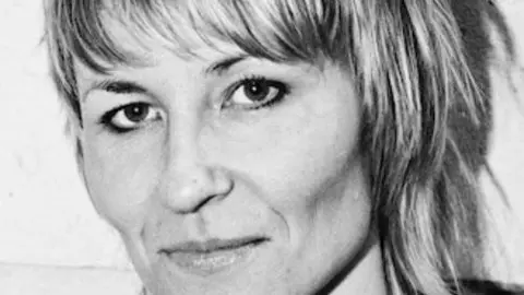 Charlotte Steeples A black and white headshot of Maxine Trump. She has short blonde hair with a fringe