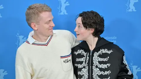 Getty Images George Jaques and Bella Ramsey pose at the "Sunny Dancer" photocall during the 76th Berlinale International Film Festival Berlin at Grand Hyatt Hotel on February 13, 2026 in Berlin, Germany