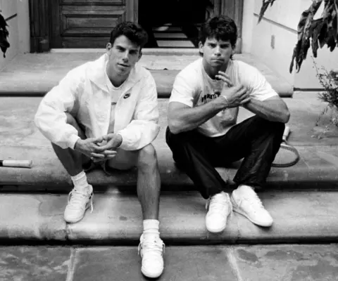 BBC Erik and Lyle Fernandez sat in front of their family home in Beverly Hills, Los Angeles, in 1989