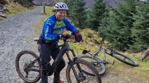 Roger Moffatt on a mountain bike