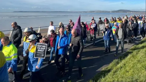 People walking with placards in Port Talbot