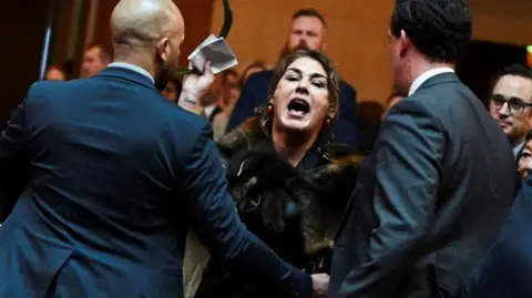 Lidia Thorpe being ejected as she heckles King Charles in Parliament House in Canberra