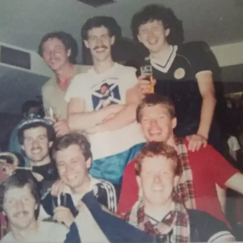 Jim Stewart A group of eight Scotland fans wearing strips and scarves in 1982