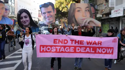 EPA Families of hostages held by Hamas in Gaza demand that the Israeli government agree a ceasefire and hostage release deal with Hamas, at a protest in Tel Aviv, Israel (8 January 2025)