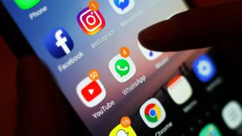 PA Media Social media apps on a mobile phone