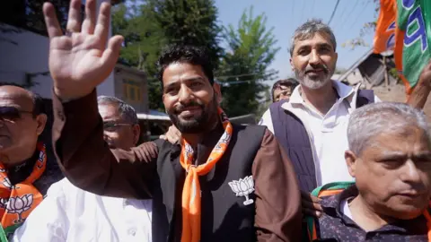 Saraskanth Pk BJP candidate Engineer Aijaz Hussain (centre) with supporters