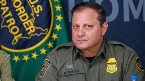 Michael Banks in uniform with his Customs and Border Patrol badge