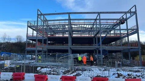 Paul O'Gorman/BBC The steelwork frame of the new building