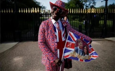 Reuters Joseph Afrane, from Ghana, poses for a photograph after arriving in Windsor, Britain, May 17, 2018. "I"m here for the big day, to congratulate them. They support the Commonwealth," said Joseph.
