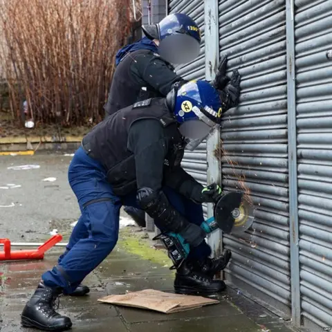 Gmp GMP officers raid suspected counterfeit goods premises