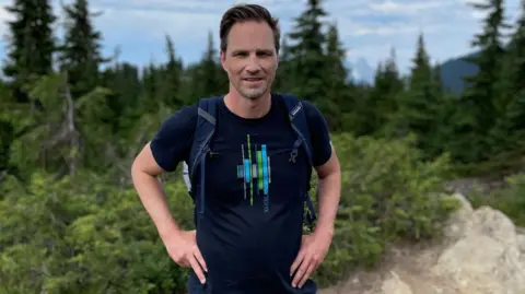 Getty Images Former Canadian trade negotiator Jason Langrish wearing casual clothing while standing in the great outdoors