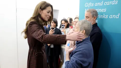 Kate hugging a patient at hospital