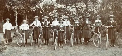 Hulton Archive A group of women and girls with bikes, circa 1900