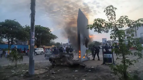 Reuters Residents set fire to mysterious monolith that appeared in Kinshasa, DR Congo