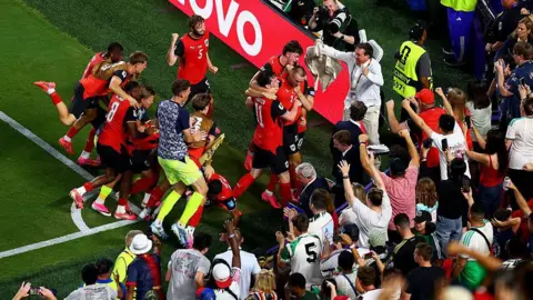 Austria players celebrate