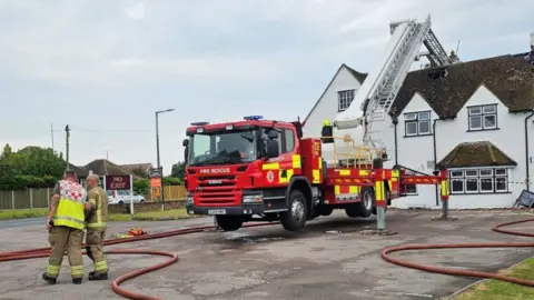 Essex Fire and Rescue A fire engine outside the Oakwood Inn