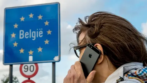 Getty Images Woman uses phone