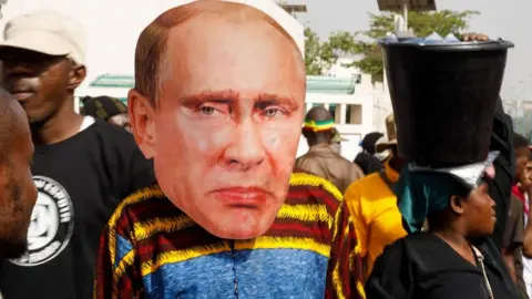 Someone wearing a Putin mask