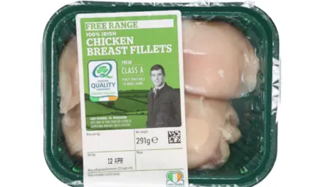Food Safety Authority of Ireland A plastic wrapped container of chicken breast fillets. The pack has an Irish tricolour on the front along with a picture of a farmer. 