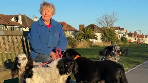 Steve Huntley/BBC Woman with dogs